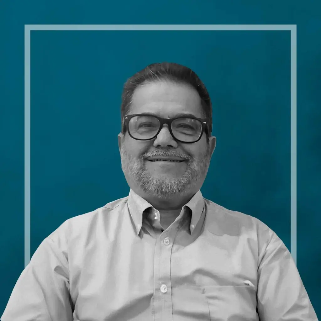 Headshot of a man with glasses.