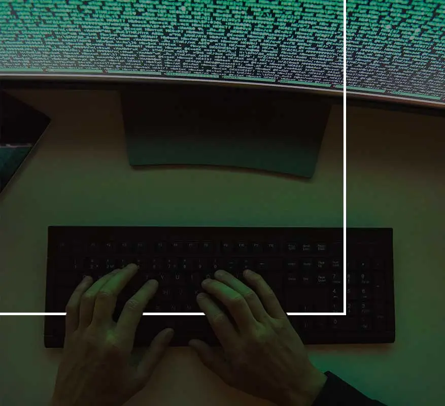 Here's a suitable alt tag: Hands coding on glowing screen.