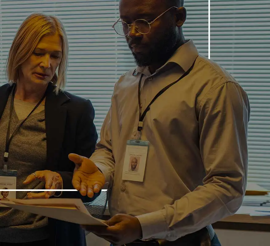 Agents reviewing case files together.